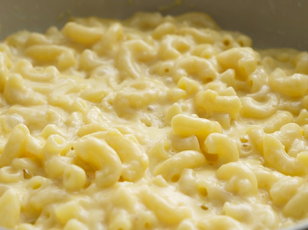 Close-up view of creamy macaroni and cheese in a pan.