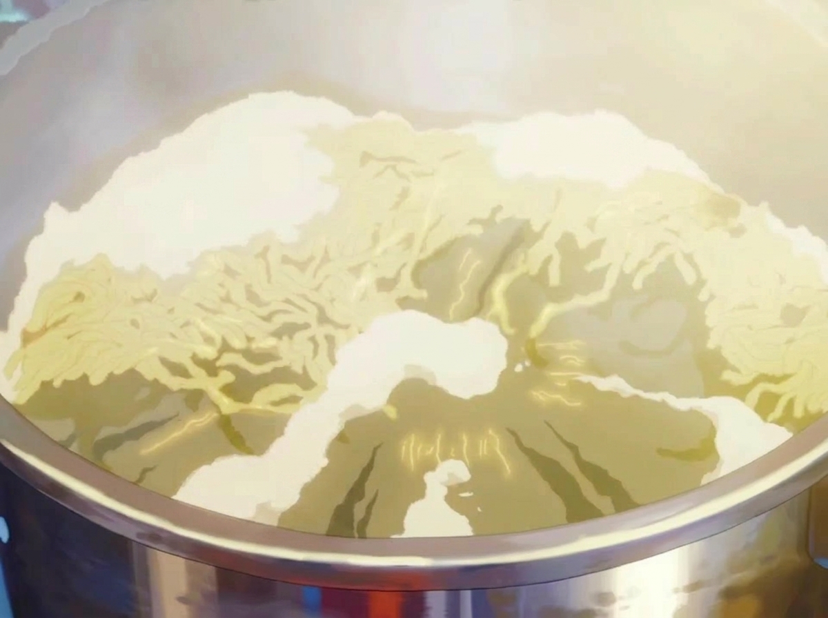 Thick ramen noodles boiling rapidly in a pot of bubbling hot water.