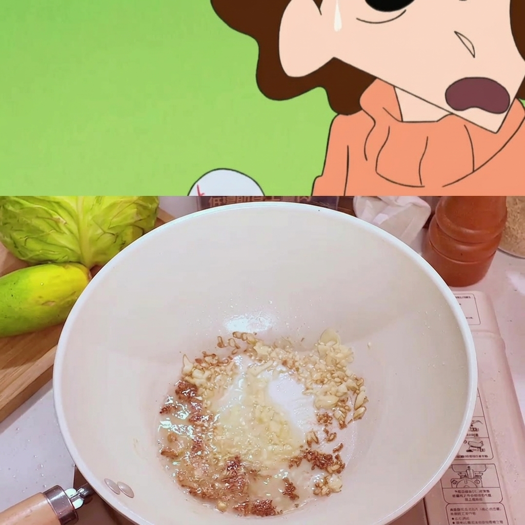A spoonful of miso paste being mixed into the sautéed garlic in the pan.