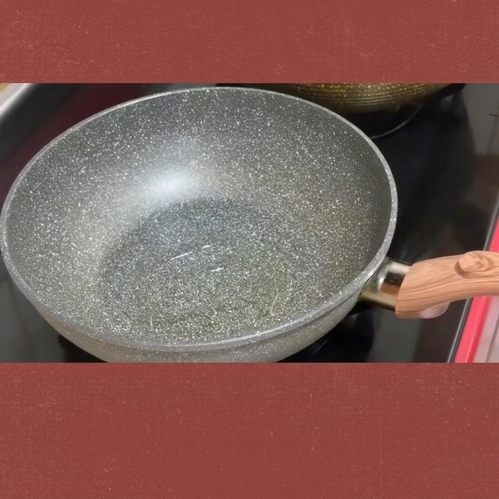 Chopped kimchi being stirred in a pan over medium heat.