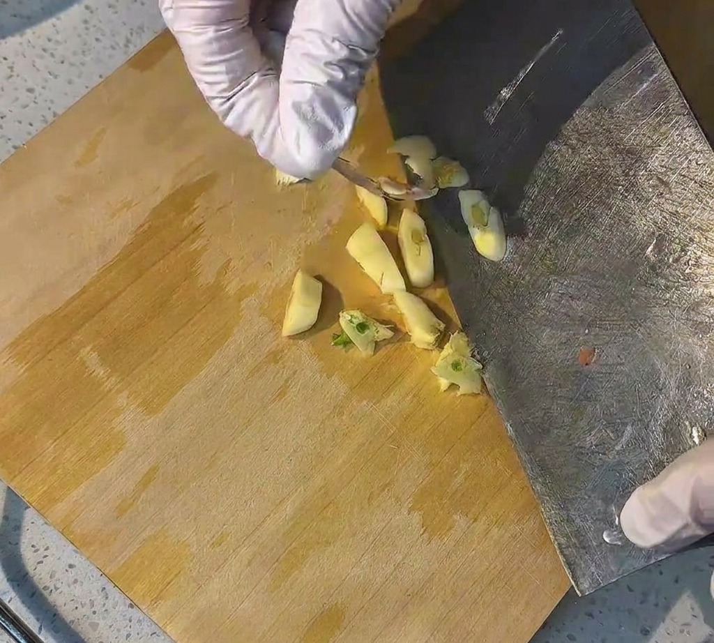 Finely minced garlic pieces ready to be used in the recipe.