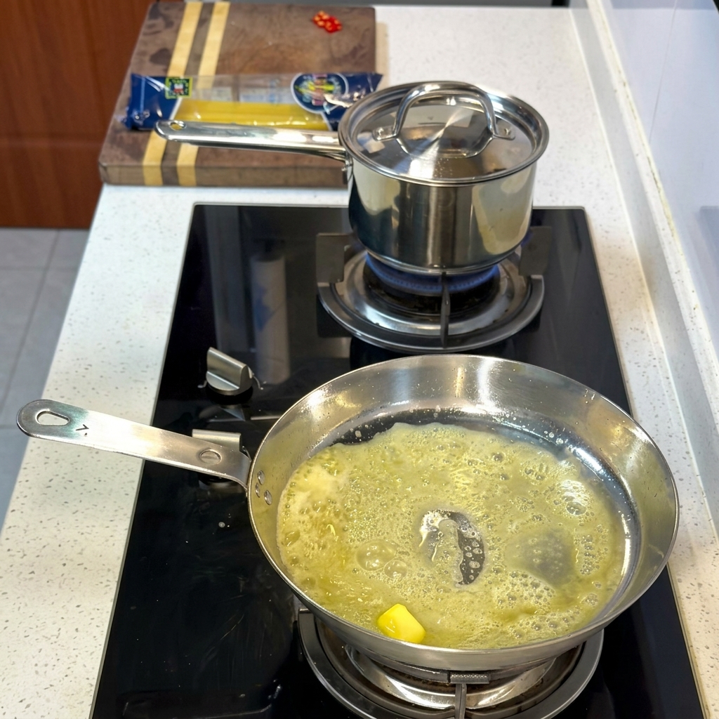 Shrimp and scallops searing in the butter and oil mixture.