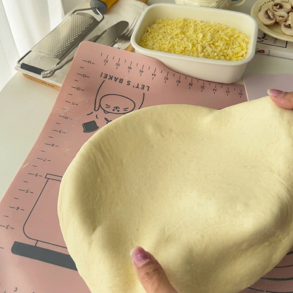Dough being pressed into an eight-inch round cake mold.