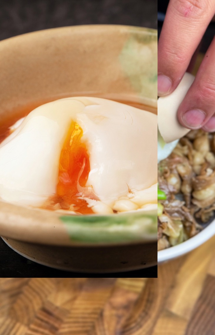 A perfectly cooked onsen egg being added to the center of a hot beef and scallion bowl.
