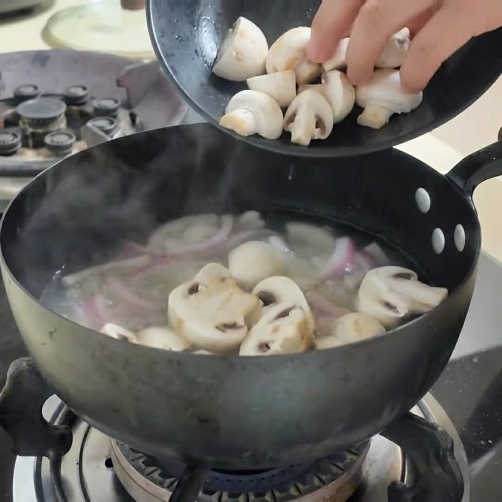 A variety of vegetables and tofu cubes being added to boiling water in a pan.