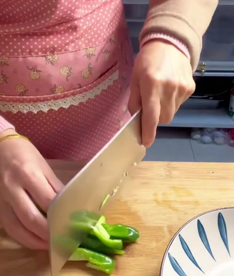Green pepper pieces chopped and ready to be added to the cooking pot.