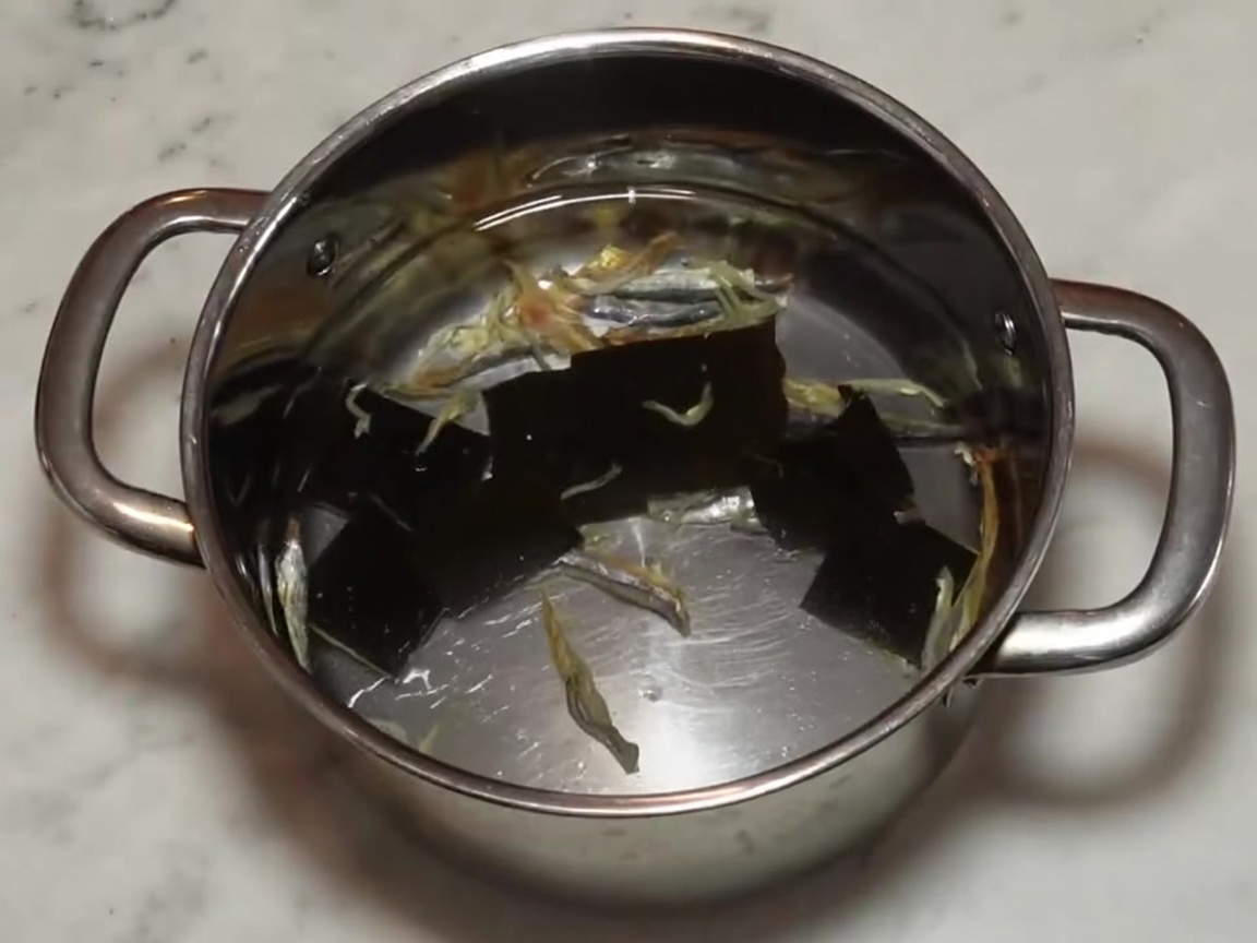 The stainless steel pot covered with a lid, ready to be placed in the refrigerator.