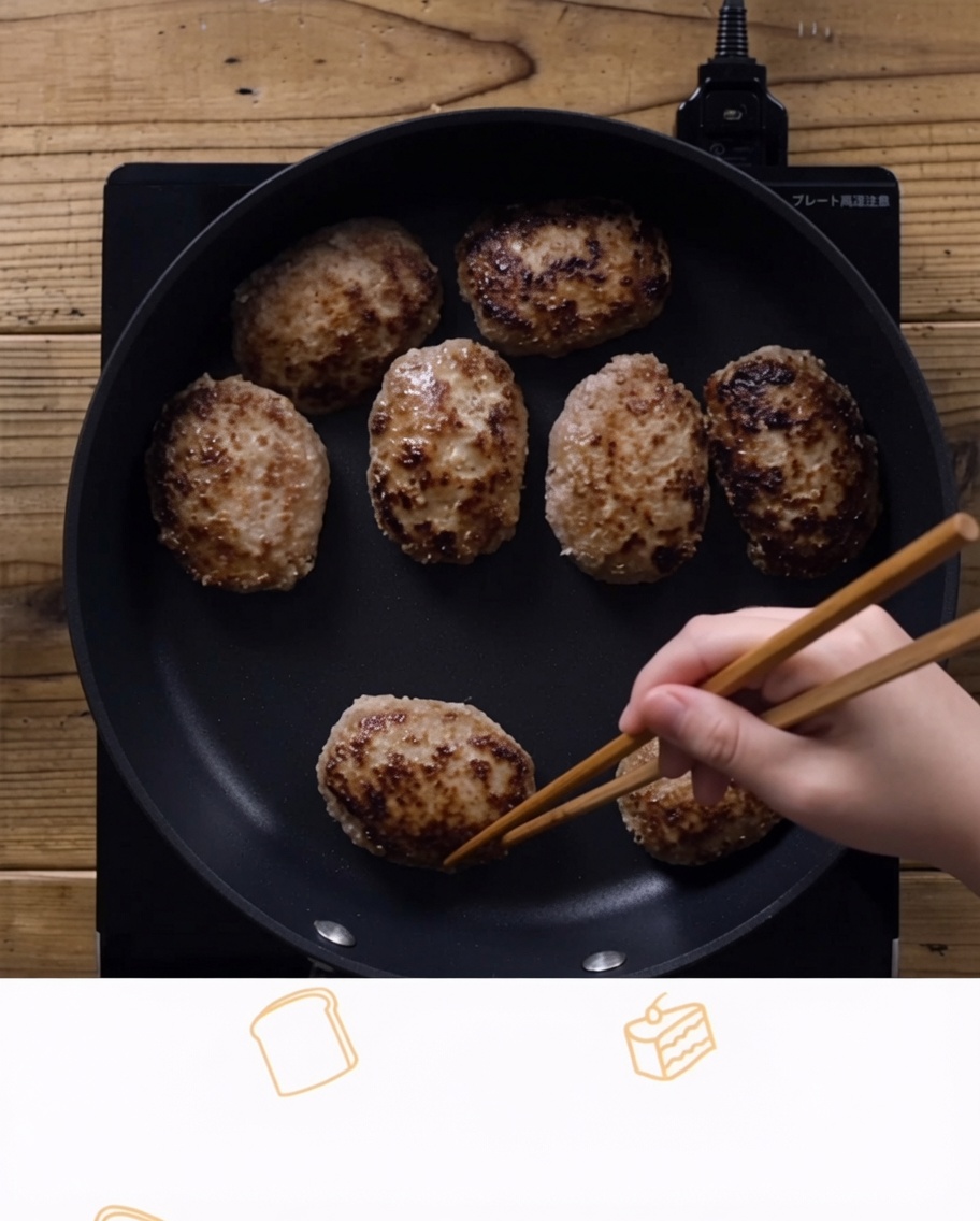 Excess oil being wiped from the pan with a paper towel and chopsticks.
