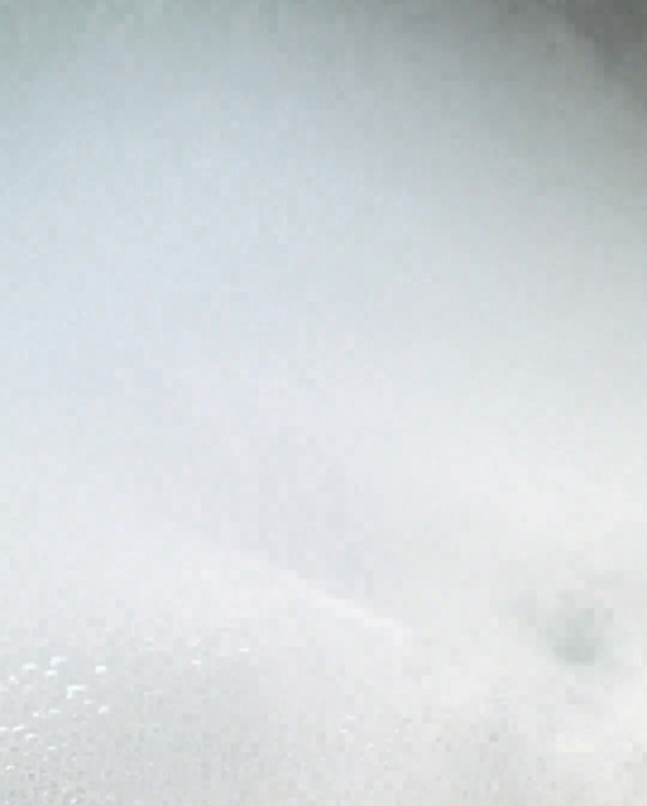 Spiral pasta cooking in a large pot of boiling, salted water.