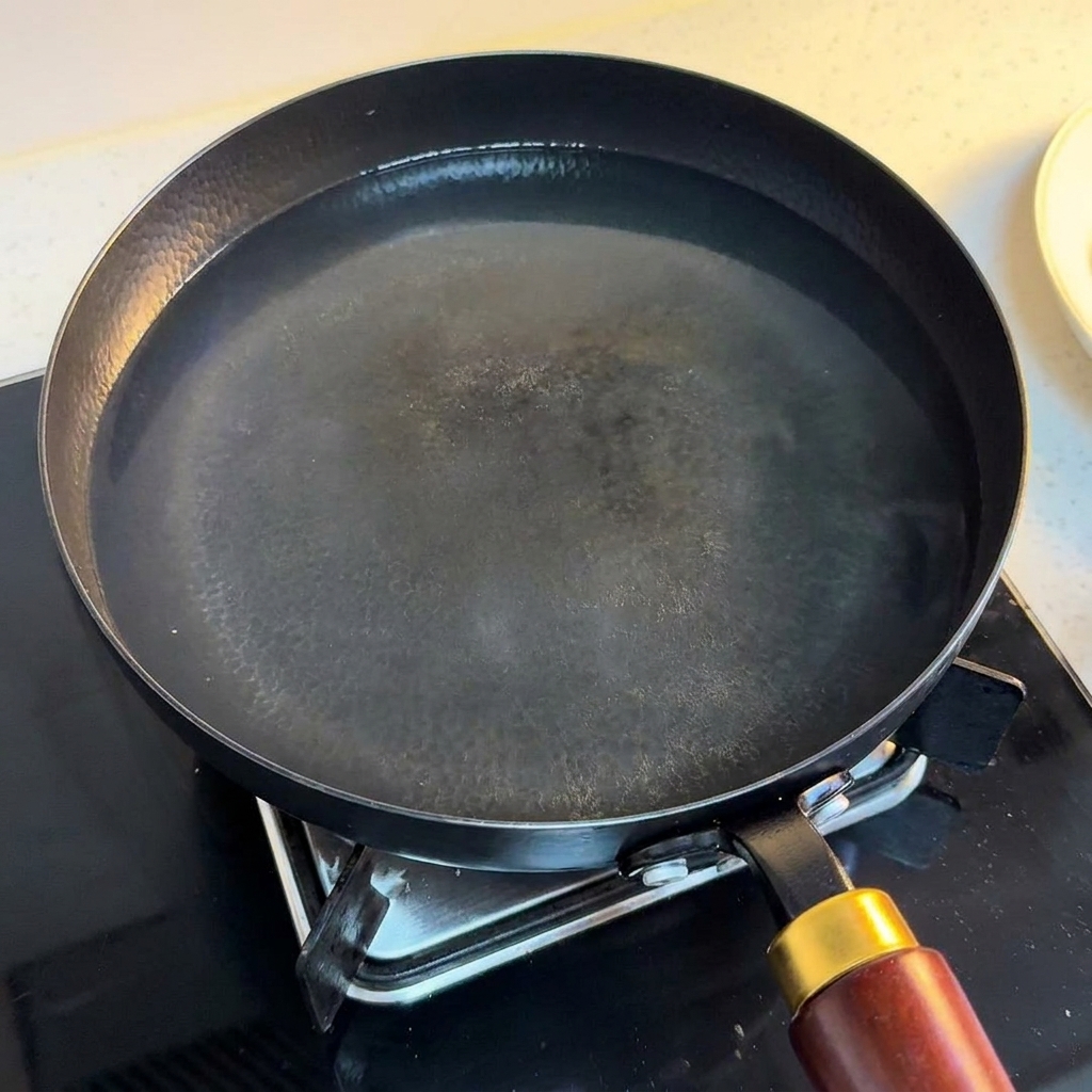 Two eggs resting in a pan of hot water