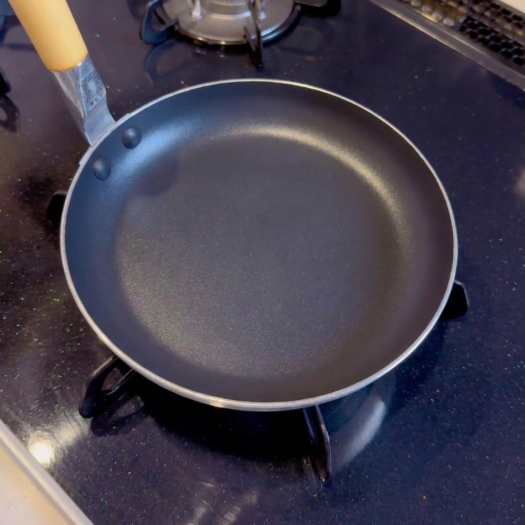 A close-up view of the ingredients mixed in a pan, beginning to heat up over the stove.