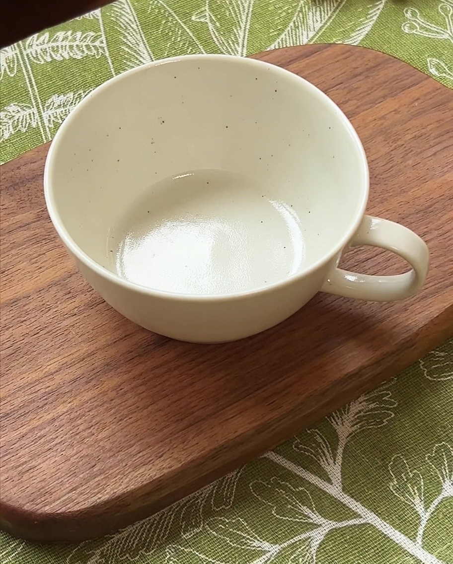 A small white bowl containing a mixture of soy sauce, sugar, Korean chili paste, and water.