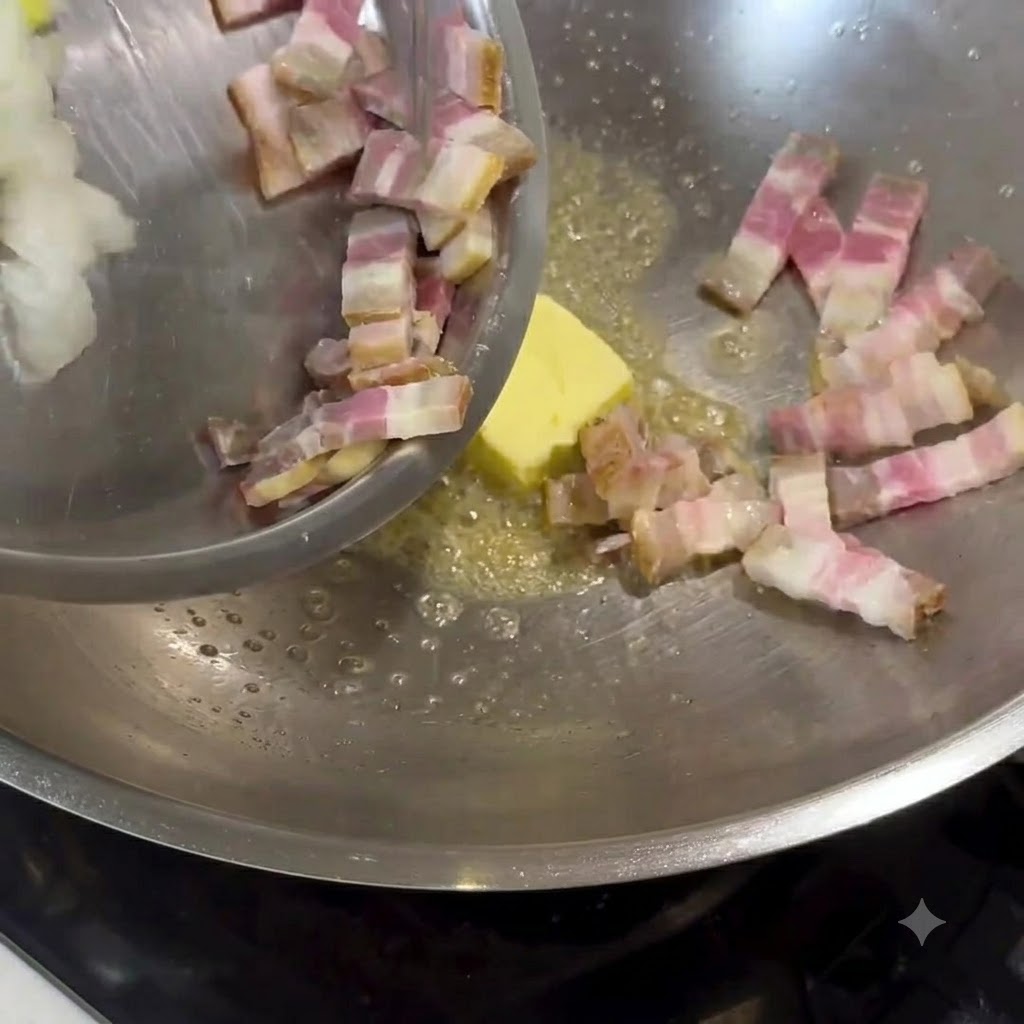 Butter melting in a metal wok, with chopped bacon and onions being added and stirred.