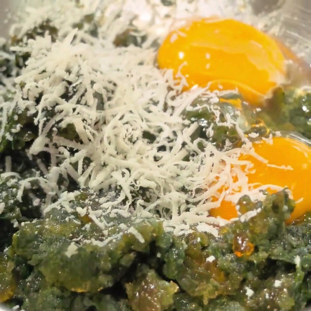 Freshly grated parmesan cheese piled over the raw eggs and preserved eggs.