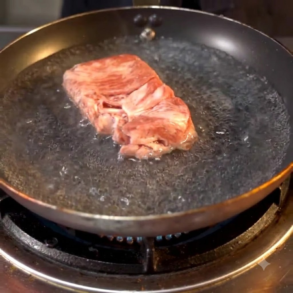 Beef rolls boiling in a pan of hot water on the stove.