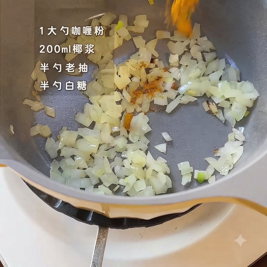 Curry powder and seasonings being sprinkled over sautéed onions inside a yellow cooking pot.