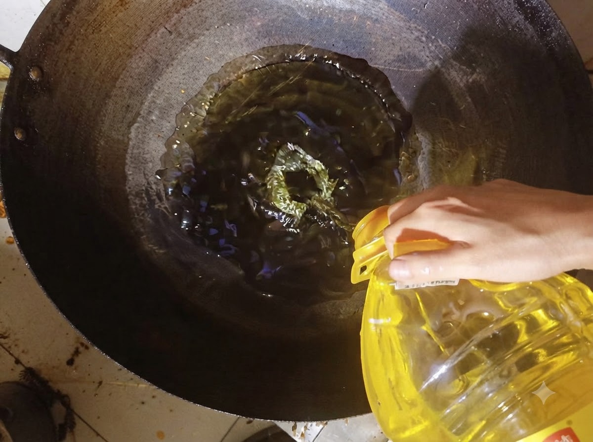 Cooking oil being poured from a container into a heated wok.