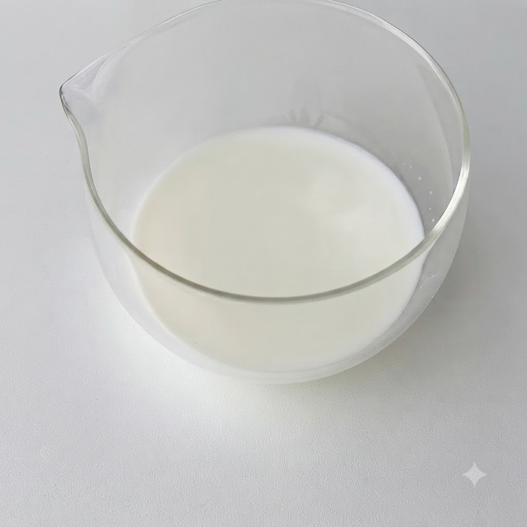 Gelatin melting inside a bowl of warm milk.