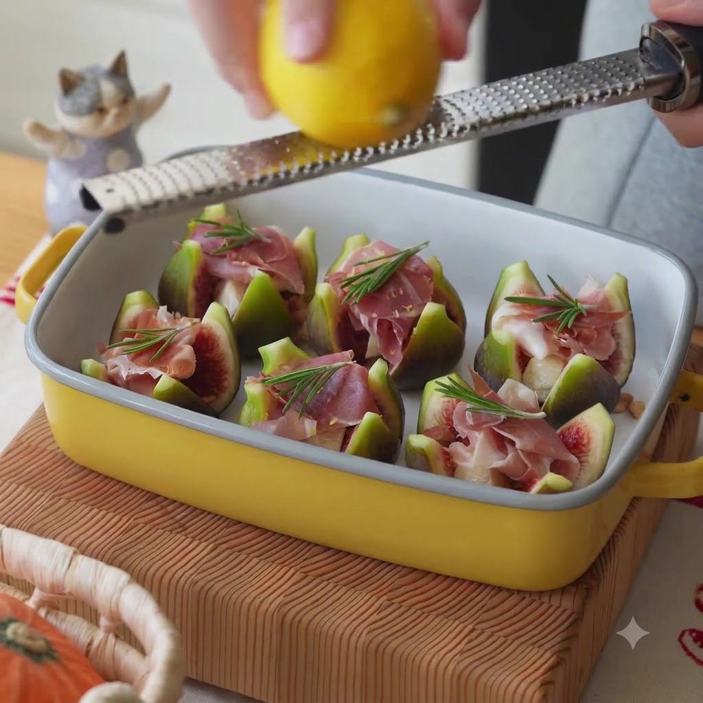 Fresh lemon zest being grated onto figs and prosciutto in a baking dish.