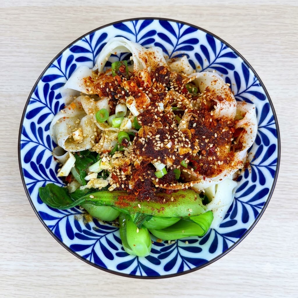 Light soy sauce, vinegar, oyster sauce, and sugar added into the bowl containing the noodles and toppings.