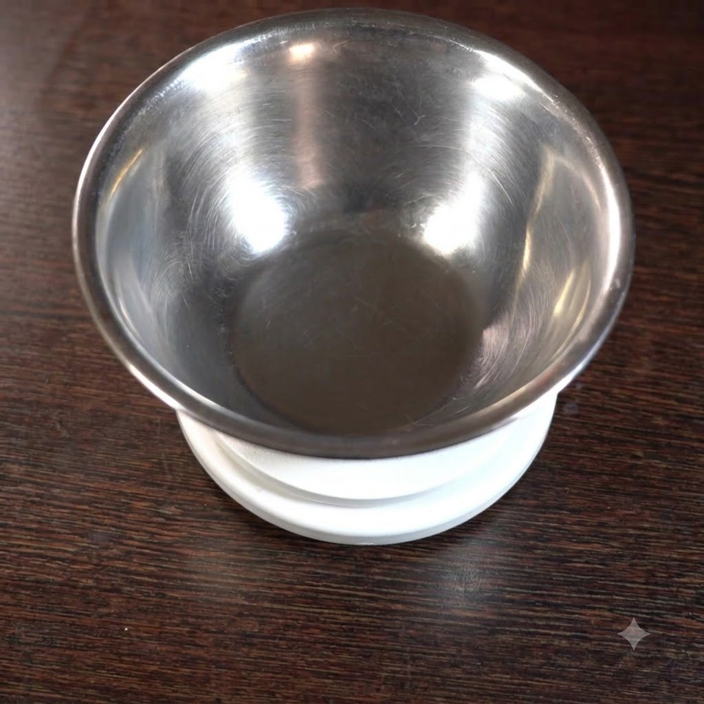 Liquid ingredients and seasonings being added into a stainless steel bowl placed on a scale.