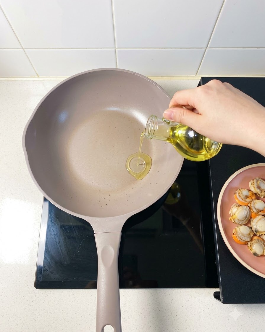 Fresh pieces of napa cabbage being placed neatly into a separate cooking pan.