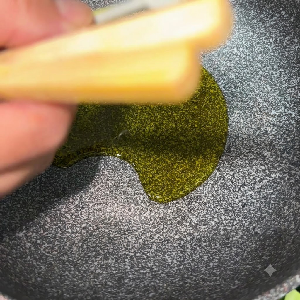 Soybean oil glistening in a cooking pan with visible salt and soy sauce seasoning.