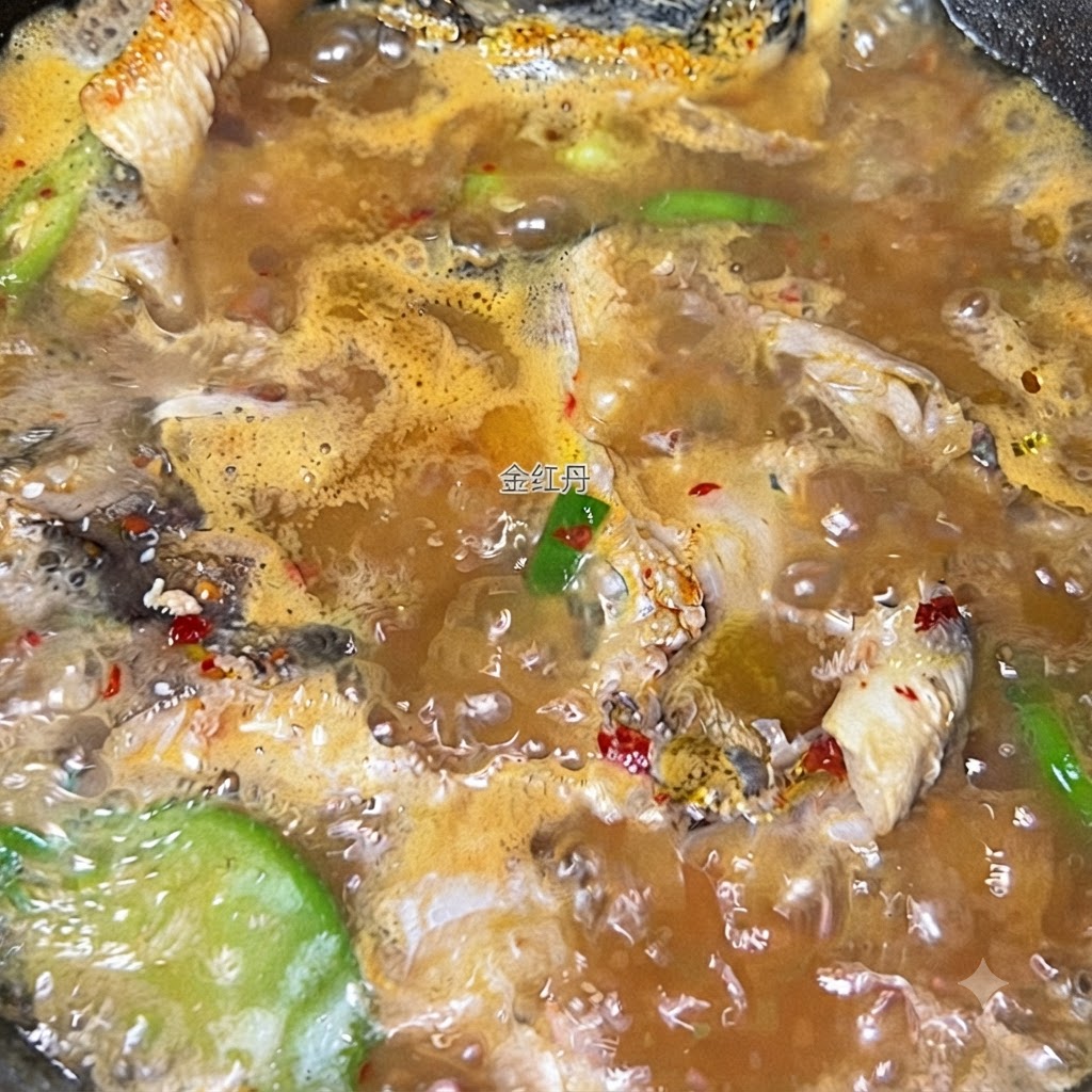 Glass noodles being submerged into the bubbling, seasoned pollack soup.