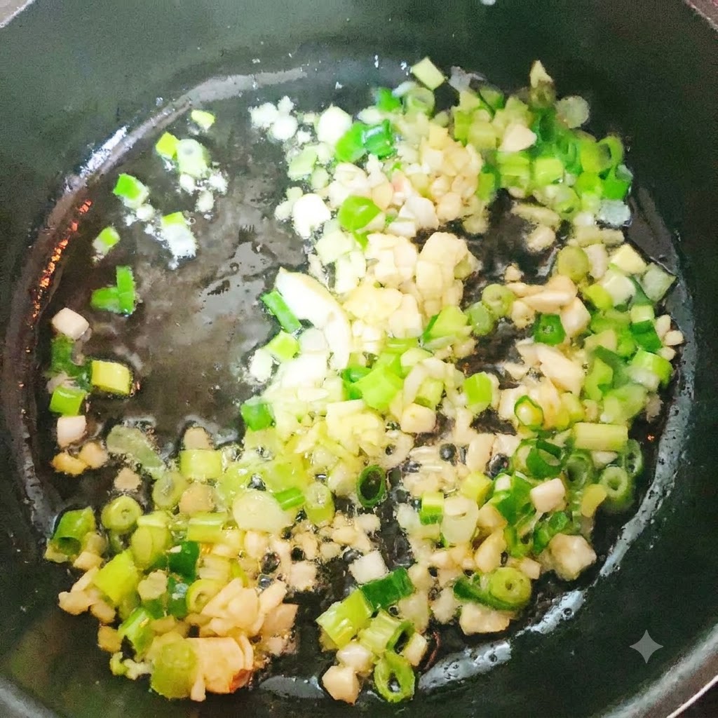 Pollock head and tail pan-frying in a pot with aromatics.