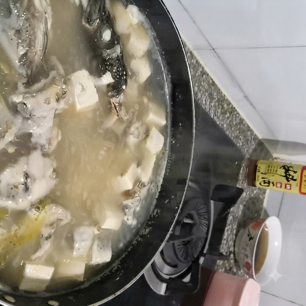 A spoon skimming foam off the surface of a boiling pot of pollock and tofu soup.
