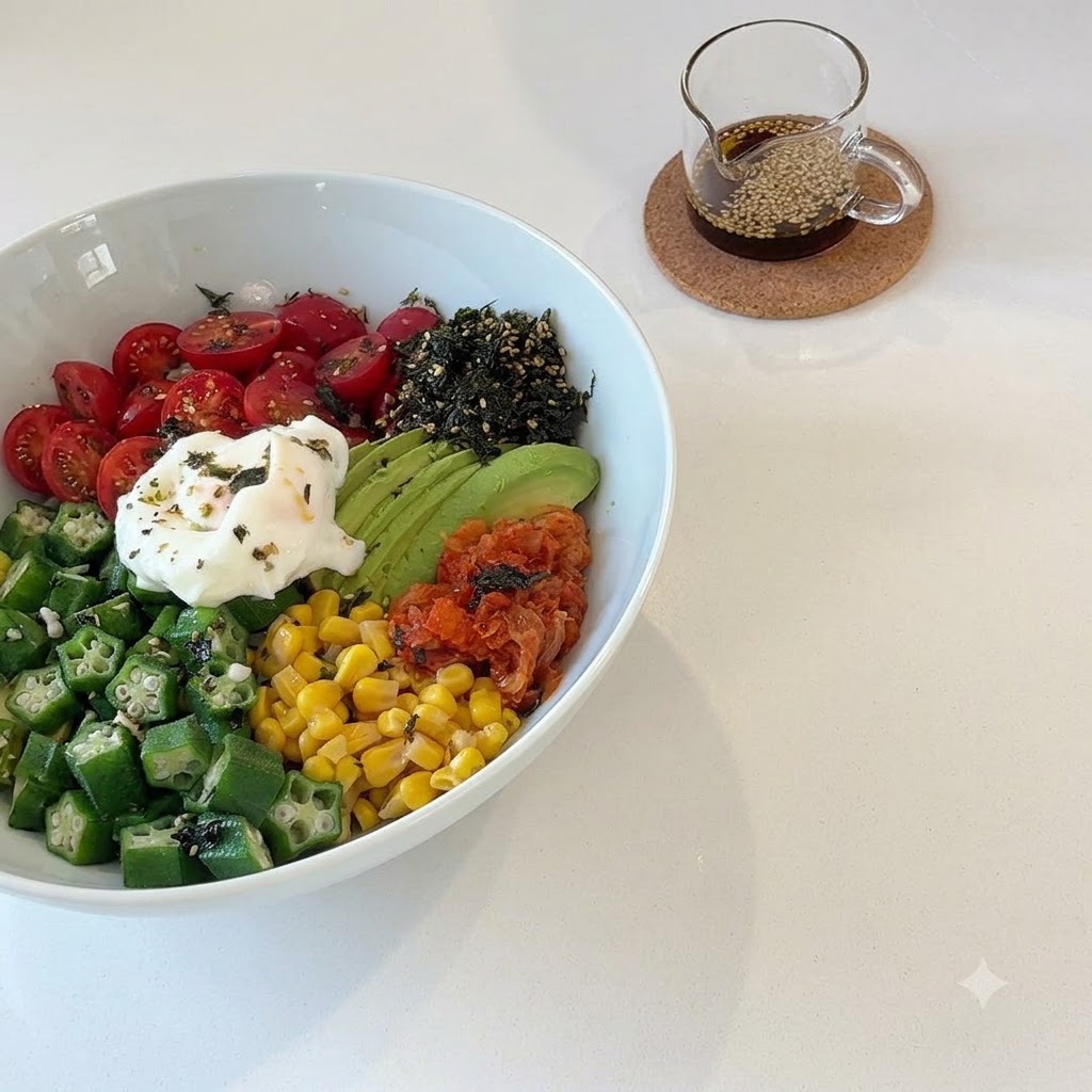 A small glass pitcher filled with a homemade dressing containing olive oil, balsamic vinegar, and white sesame seeds.