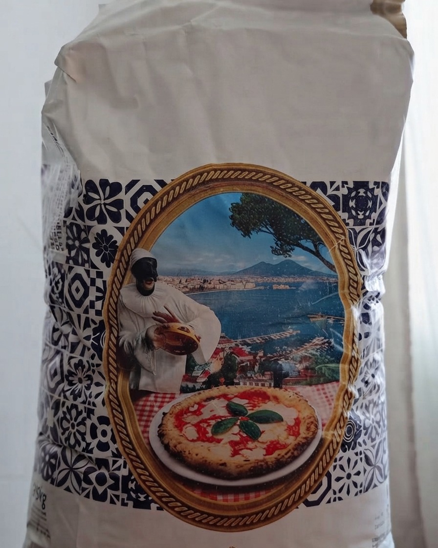 A bag of Molini Ambrosio type 00 pizza flour being opened in preparation for the dough.