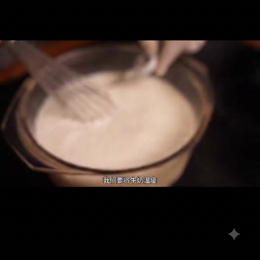 Milk being stirred in a glass bowl with a whisk and a thermometer inserted.