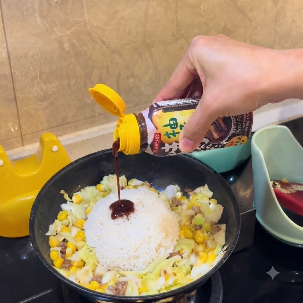 A bottle of savory barbecue sauce being squeezed to drizzle dark sauce over the mound of white rice in the pan.