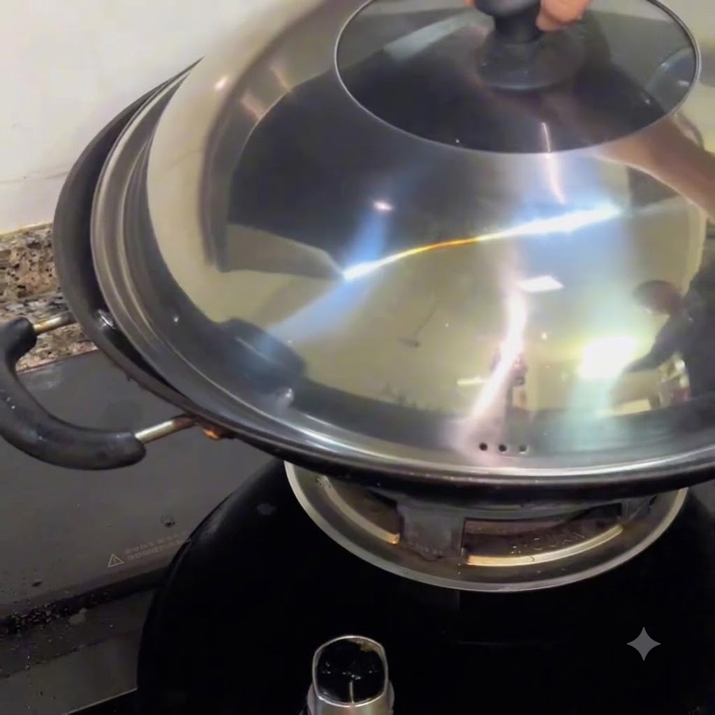 A metal lid securely placed on top of a hot wok, trapping steam to braise the clams inside.